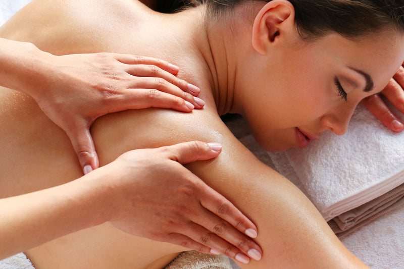 Woman relaxing while receives a massage