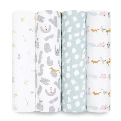 Four muslin swaddles featuring alphabet letters, animal illustrations, and playful patterns, from Aden + Anais.