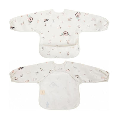 Long-sleeve smock bib for babies and toddlers featuring woodland animal prints and a large front pocket.