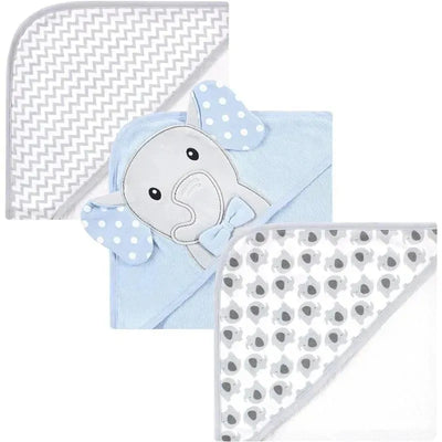Three cotton-rich hooded baby towels in pastel colors with an elephant design, chevron pattern, and gray polka dots.