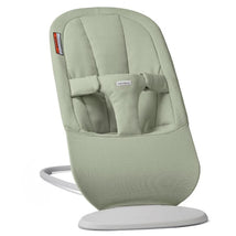 Babybjorn Bouncer Begin in light green fabric, featuring a supportive design and safety harness for infants.