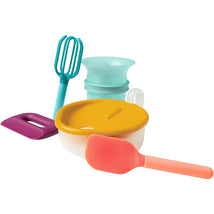 Boon Intro Toddler Food Prep Set including a bowl with yellow lid, mixing whisk, spatula, and a measuring cup.