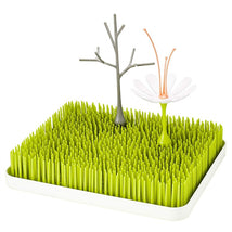 Boon Lawn & Twig & Stem drying rack with green grass-like base, featuring a grey tree and a white flower accessory.