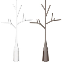 Boon TWIG drying rack accessories in white and grey, designed as tree-like structures for drying bottles and small items.