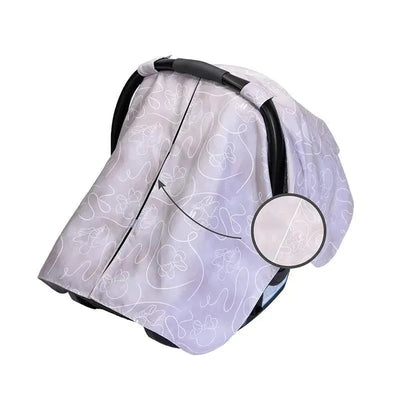 Reversible lavender car seat canopy with Minnie Mouse design, providing shade and privacy for infants.