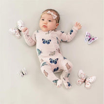 Zippered footie for infants in blush with colorful butterfly patterns, featuring a baby girl lying on a light background surrounded by butterfly toys.