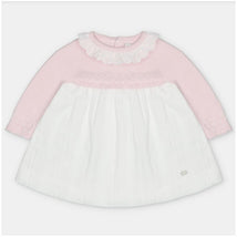 Martin Aranda dress in light pink sweater knit with a white fabric skirt, featuring a ruffled neckline and decorative stitching.