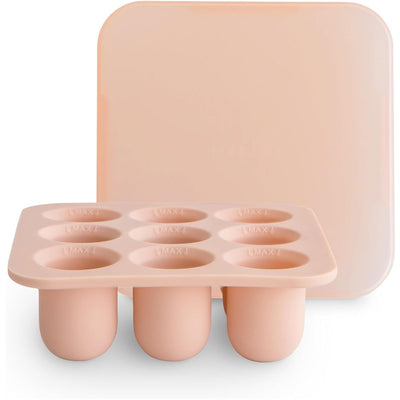 Mushie Fresh Food Feeder Freezer Tray in blush color with six circular compartments and a fitted lid for easy storage.