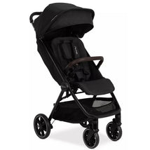 Nuna TRVL LX Compact Stroller in Caviar/Chocolate with a black canopy, padded seat, and four wheels.