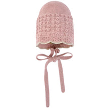 Knit newborn bonnet in cream and beige with a textured design and ties for secure fitting.