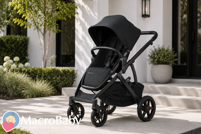 Black UPPAbaby Vista V3 stroller parked outside a modern home with clean landscaping and soft natural sunlight, showcasing its premium design in a stylish residential setting.