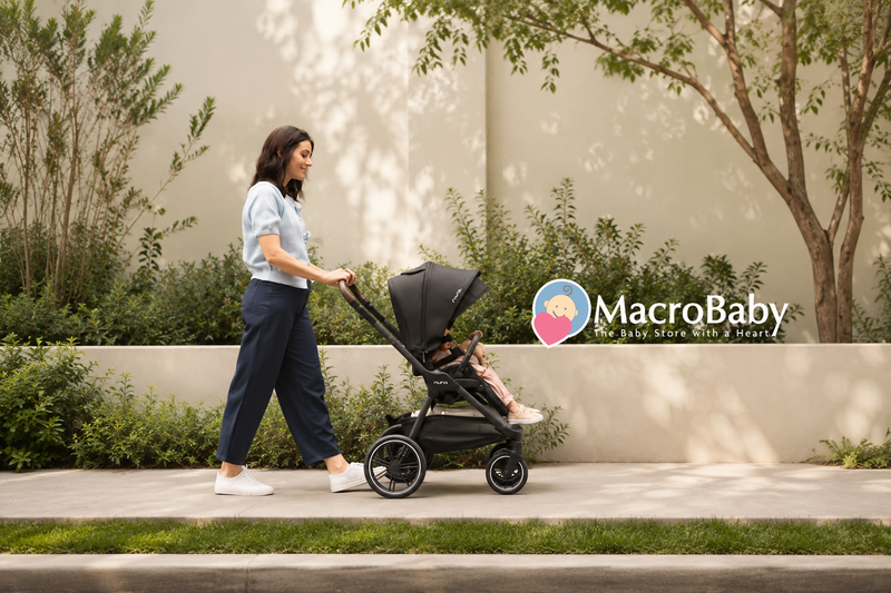 Mom pushing a stroller with her child outdoors.