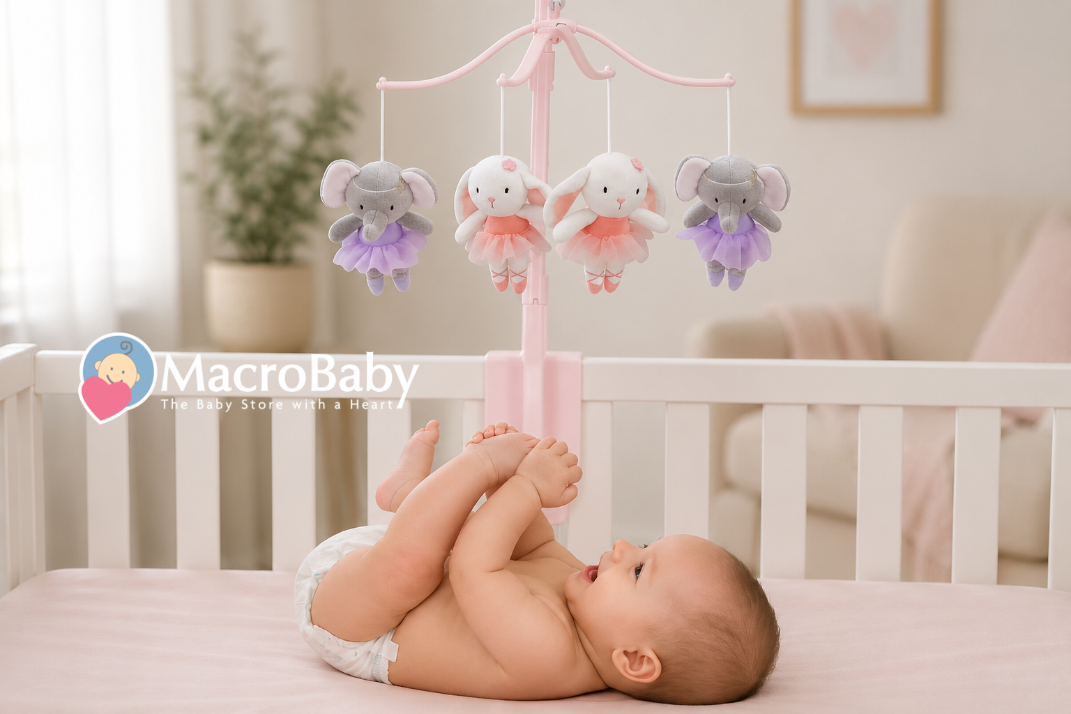 Baby looking at a pink crib mobile with plush animals
