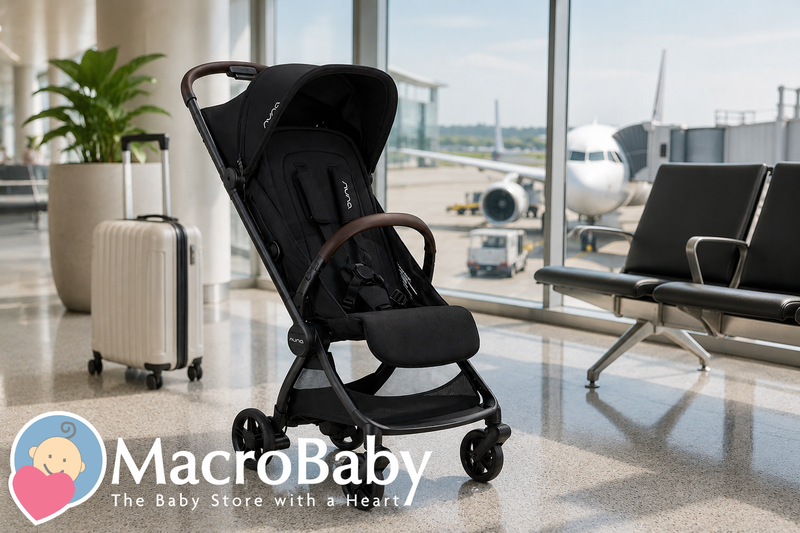 Black Nuna stroller at airport terminal with suitcase and airplane view