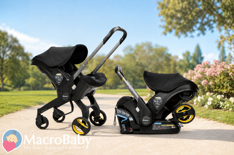 Black Doona+ infant car seat and stroller combo with yellow wheels on park path