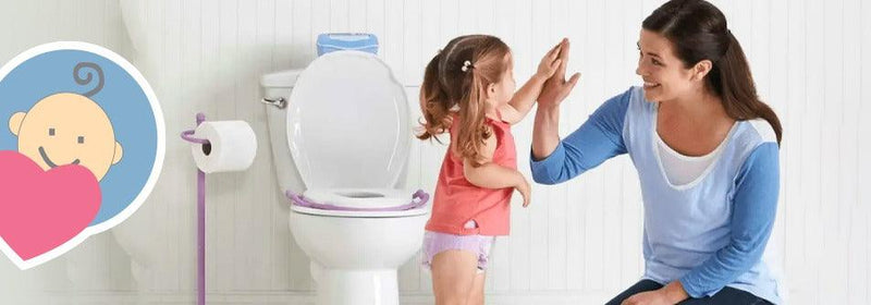 Mom and toddler high-fiving beside toilet with purple training seat, potty training success moment