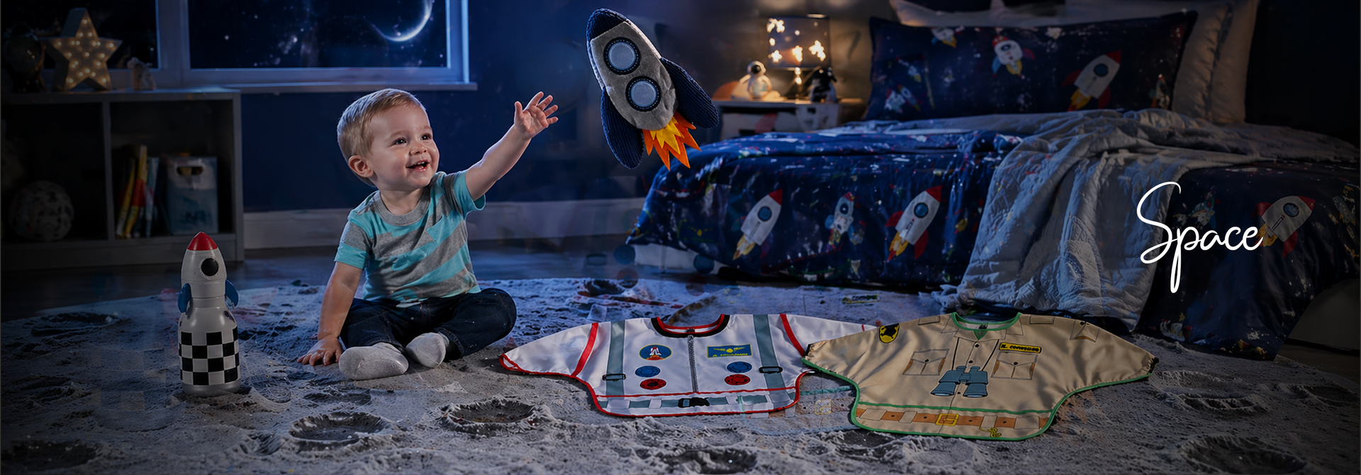 Toddler playing with rocket toy in space-themed bedroom, astronaut bibs and bedding for baby boys