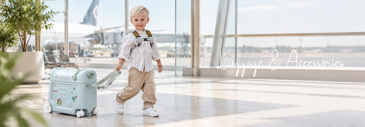 Boy with kids’ luggage at an airport