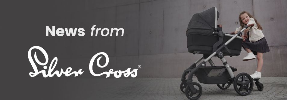 Silver Cross stroller with child smiling beside it, modern urban setting