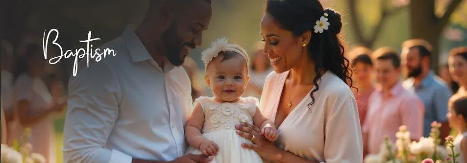Baby in white dress at outdoor baptism with smiling parents and guests