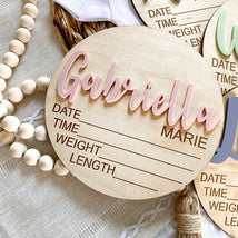 Personalized wooden baby birth announcement sign with name Gabriella Marie, for nursery decor and newborn keepsakes.