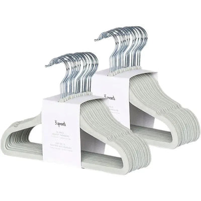 15-pack of green velvet baby hangers with chrome hooks, designed for delicate clothing storage.