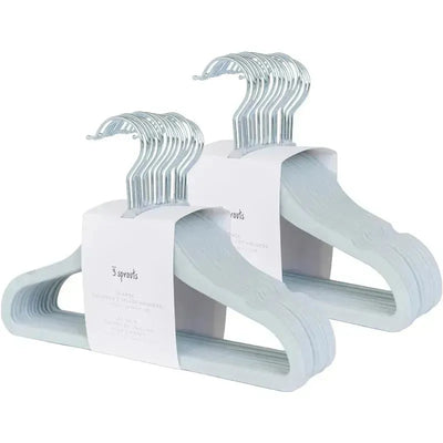 Velvet baby hangers in blue, non-slip and durable, shown in a pack of 15 with a label identifying the product.