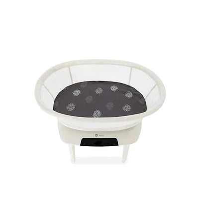 Grey cotton bassinet sheet for 4 Moms Mamaroo Sleep, featuring a patterned dark surface in a rounded, mesh-sided bassinet.