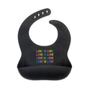 About Face Designs Soft Silicone Baby Bib All over Love is Love Print, Black Image 1