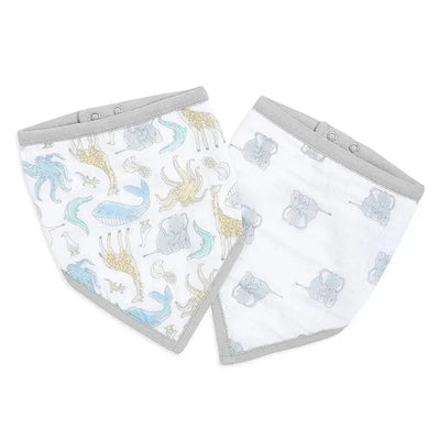 Two Aden+Anais bibs featuring whimsical animal designs in soft colors, with snap closures and grey trim.