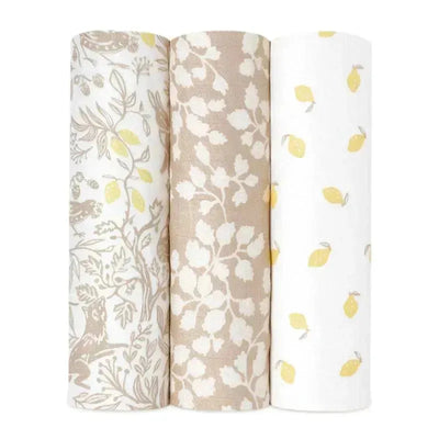 Three Aden + Anais swaddle wraps: one features woodland animals, the second has a leaf pattern, and the third is printed with lemons.