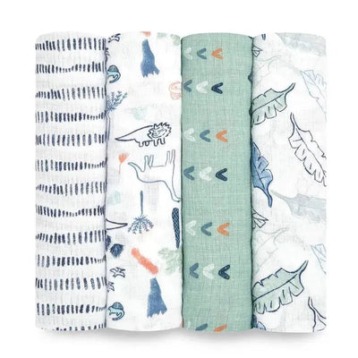 Four cotton muslin swaddle blankets from Aden + Anais featuring dinosaur and nature-themed patterns in soft colors.