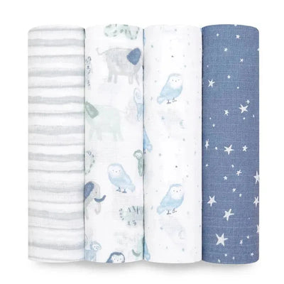 Four muslin swaddles from Aden + Anais featuring light patterns: stripes, animals, stars, and soft hues for baby comfort.