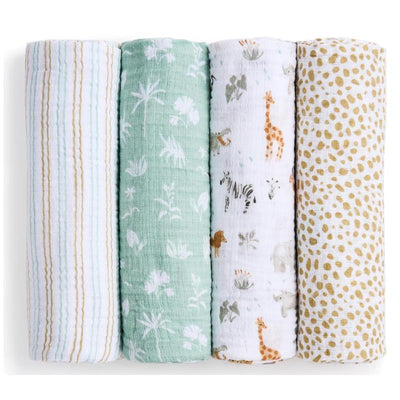 Set of four cotton muslin swaddles in various patterns, including giraffes and nature motifs, from Aden + Anais.