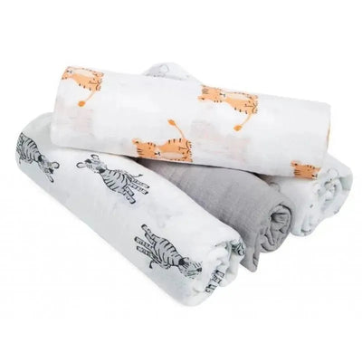 Four muslin swaddles from Aden + Anais featuring animal prints, including tigers and zebras, with one solid gray swaddle.