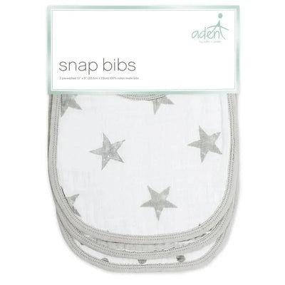 Three cotton muslin snap bibs featuring a grey star pattern, packaged under the Aden + Anais brand.