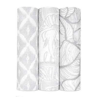 Three Aden + Anais swaddles featuring various grey patterns: geometric, elephant, and leaf designs.