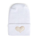 Fuzzy ivory hospital hat for babies with a heart-shaped embroidery on the cuff. Perfect for newborn gifting.