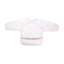 Long sleeve smock bib in white with pink floral patterns and a pocket, designed for children to keep clothing clean during meals.