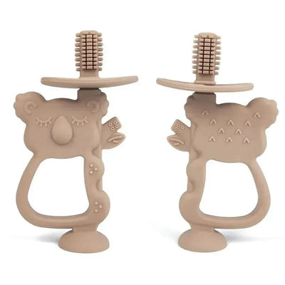 Taupe koala-shaped training toothbrush with textured bristles, designed for children’s oral care.
