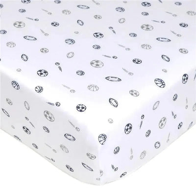 Fitted crib sheet in grey cotton jersey knit featuring a playful sports motif with various sport balls.