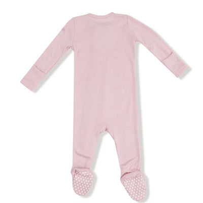 Light pink long-sleeve footie for babies with a two-way zipper and polka dot foot grips.