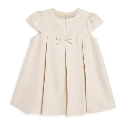 Beige jacquard dress for baby girls, featuring a small bow at the waist and short puff sleeves.