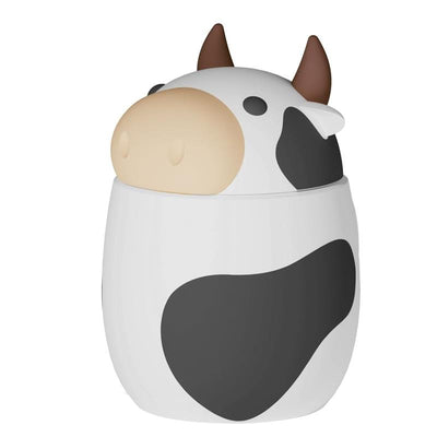 Cow-shaped food container with a removable lid featuring a black and white design, suitable for storing pet food.