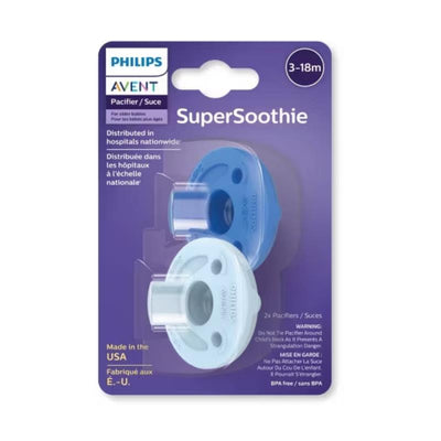Two Avent Soothie pacifiers in sky blue and light blue for babies aged 3-18 months, displayed on a packaging with a warning label.