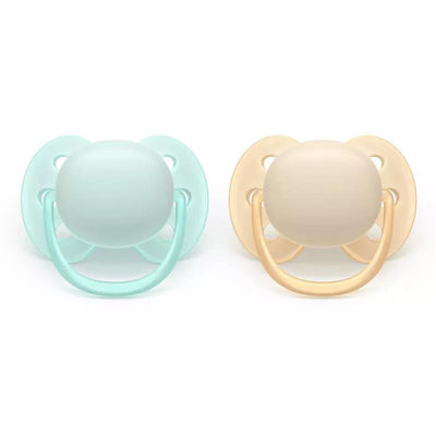 Avent 2Pk Ultra Soft Pacifier for 0-6 months in sand and pale mint colors, featuring round soft nipples and rings.