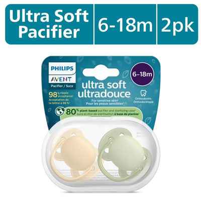 Avent 2-pack ultra soft pacifiers for infants aged 6-18 months in beige and pastel warm green, featuring a sterilizing case.