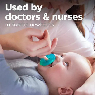 Child smiling while being comforted by a caregiver using a teal pacifier, text mentions use by doctors and nurses.
