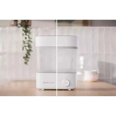 Premium electric steam sterilizer and dryer by Avent, featuring a sleek design with control button, releasing steam.