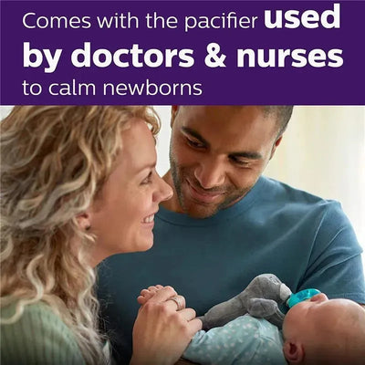 Avent Soothie Snuggle sloth pacifier held by a couple, smiling at their sleeping baby, promoting soothing comfort for newborns.